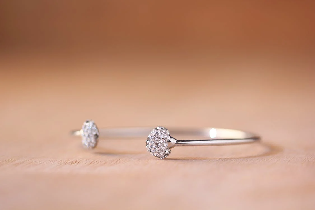 silver open cuff bracelet with diamond cluster ends