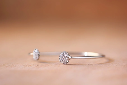 silver open cuff bracelet with diamond cluster ends